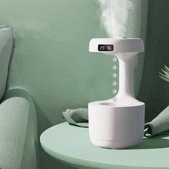 LED water drop humidifier diffuser with clock display, adding modern aesthetic and essential humidity to your home.