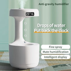 LED water drop humidifier diffuser with clock display, fine spray, and mute operation for optimal home humidity.